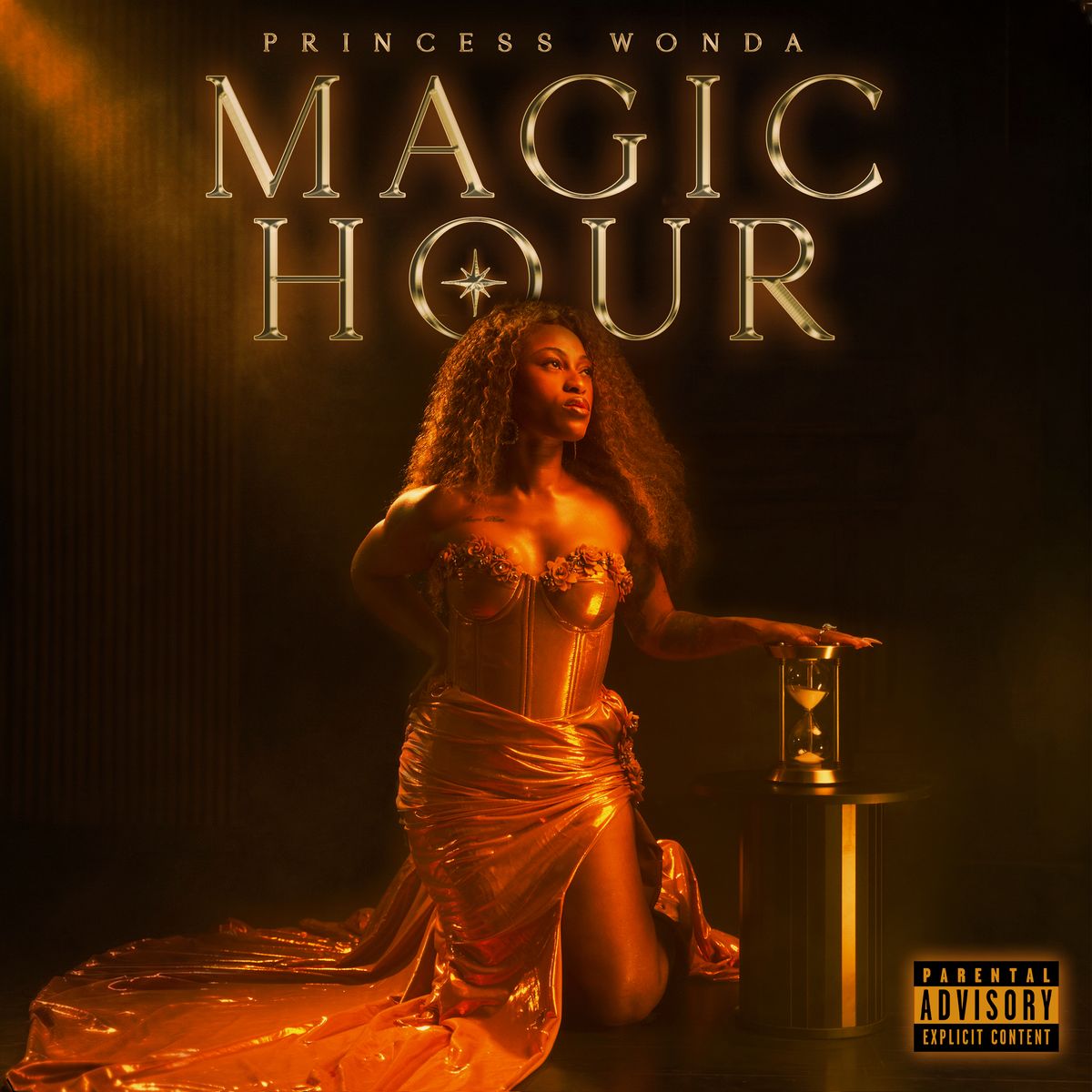 Magic Hour front cover: Princess Wonda kneeling in a gold gown beside an hourglass.