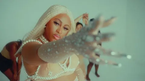 Still from iSurrender, Official Video